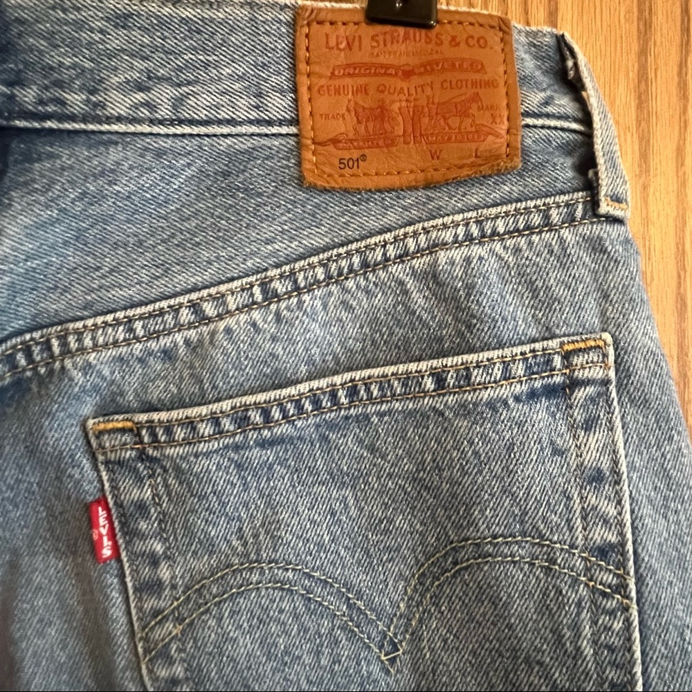 Lighter washed Levi’s distressed jeans
